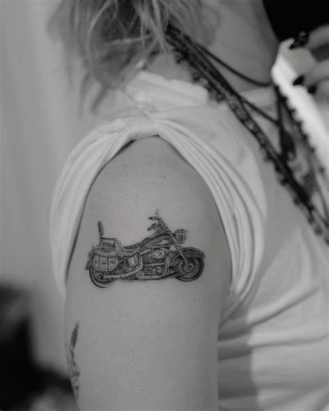 miley cyrus motorcycle tattoo|miley cyrus lower back tattoo.